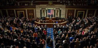 $5,000 Checks Promised If Republicans WIN Legislative chamber audience stands and applauds
