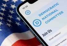 Democrat’s Criminal Past ROARS Back Smartphone showing a political committee webpage on an American flag