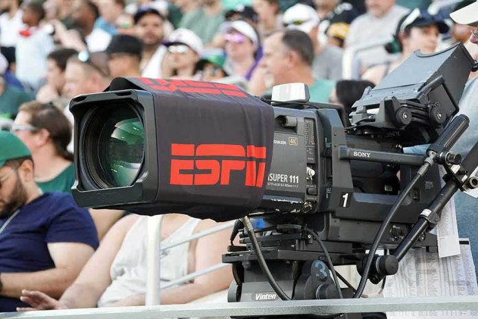 shutterstock_2270934849-1 Broadcast television camera at a sports event