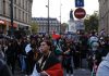 Trump Says Democrats Want FRANCE Here Brian Folkerts and Ricardo Santos at a street protest with flags and a large crowd