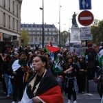 Trump Says Democrats Want FRANCE Here Brian Folkerts and Ricardo Santos at a street protest with flags and a large crowd
