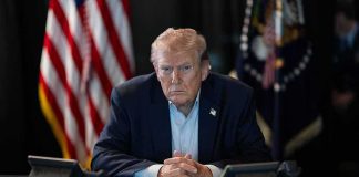 Why Trump’s Ukraine Instincts Could Be RIGHT Donald Trump seated at a table between two desk phones