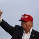 Trump Will Pay You For SNITCHING Donald Trump waving in a red cap