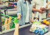 Your Tax Dollars Stolen in Food Stamp FRAUD Customer paying with a card at a supermarket checkout