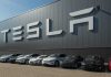 Watch Tesla’s New Roadster Go AIRBORNE Tesla cars parked outside a large Tesla building