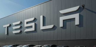 Watch Tesla’s New Roadster Go AIRBORNE Tesla cars parked outside a large Tesla building