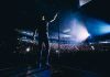 Country Star Makes BOLD Political Statement Onstage Singer on stage facing a large concert crowd