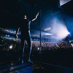 Country Star Makes BOLD Political Statement Onstage Singer on stage facing a large concert crowd