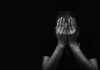 Child Predator Sting Takes a DISTURBING Turn person covering face with both hands in darkness