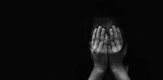 Child Predator Sting Takes a DISTURBING Turn person covering face with both hands in darkness