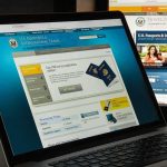 State Department Warns Americans GET OFF Tourist Island Laptop displaying U.S. passport application website