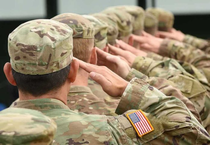 Soldiers in camouflage uniforms saluting in formation