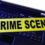 Gunpoint RAPE Alleged Inside College Dorm Laptop keyboard with yellow crime scene tape across it