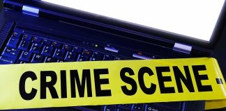 6+ Senators Targeted With Mystery White POWDER Laptop keyboard with yellow crime scene tape across it