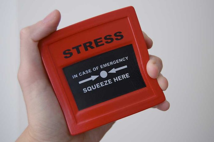 457000480 featured image Hand holding red stress relief device