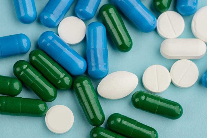 1323798659 featured image Blue, green, and white pills scattered on surface.