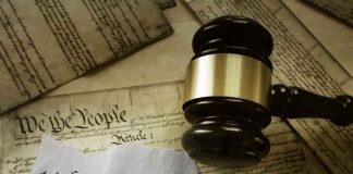 Gavel and Constitution with 14th Amendment paper