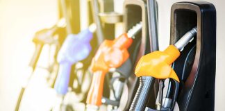 Colorful gas pump nozzles at a station