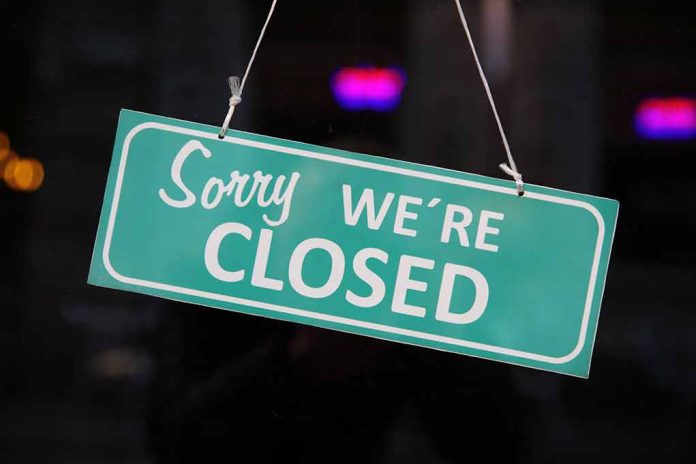 283447886 featured image Green Sorry, We're Closed sign hanging in window.