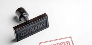 Rubber stamp with Endorsed on paper.