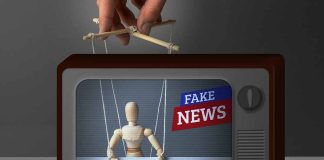 Puppet manipulated inside TV with fake news banner