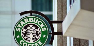 Starbucks coffee shop sign on building.