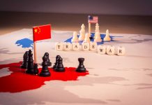 Trade war concept with chess pieces and flags