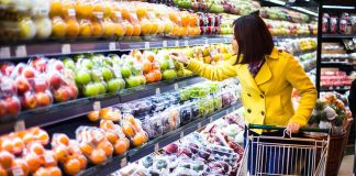 Woman shopping for fruit in a grocery store