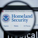 Magnifying glass showing Homeland Security website