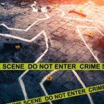 Chalk outline at a crime scene with evidence markers