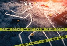 Chalk outline at a crime scene with evidence markers