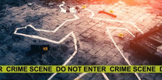 Chalk outline at a crime scene with evidence markers