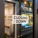closing down sign on glass door