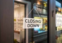closing down sign on glass door