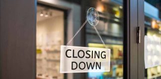 closing down sign on glass door