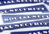 Blue Social Security cards piled together