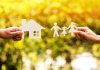 Paper cutouts of a house and family outdoors