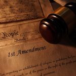 First Amendment document with gavel and Constitution background