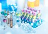 Vials and blister packs of pills on table