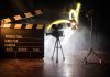 Film set with clapperboard camera and lighting