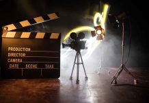 Film set with clapperboard camera and lighting