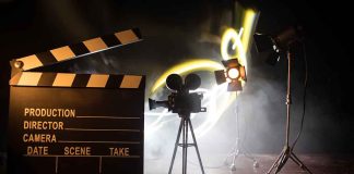 Film set with clapperboard camera and lighting