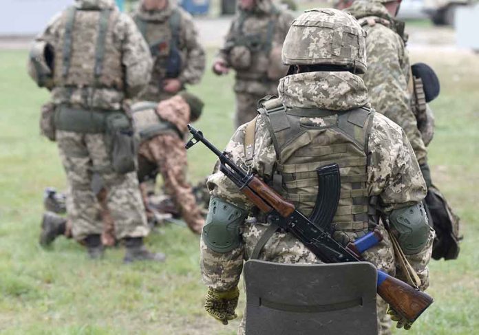 2057061182 featured image Soldiers in camouflage gear gathered on grass field