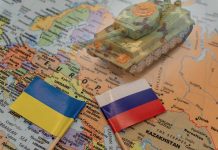 Tank on map with Ukrainian and Russian flags