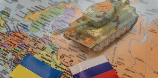 Tank on map with Ukrainian and Russian flags
