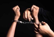 Handling handcuffs and unlocking with a key