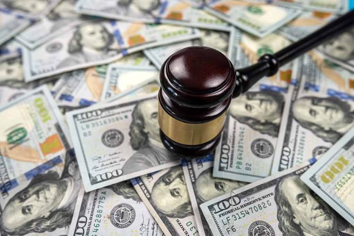 2200663999 featured image Gavel on pile of hundred dollar bills