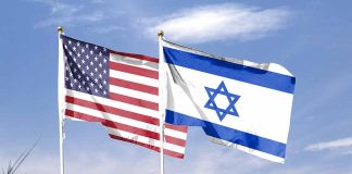 American and Israeli flags waving in the wind.