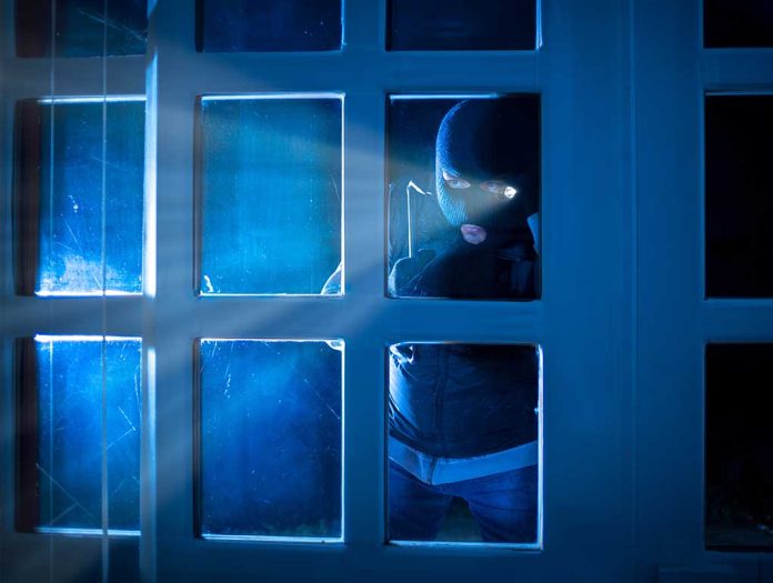 514808032 featured image Masked figure peering through glass door at night