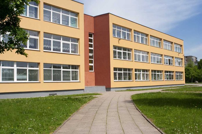 525554962 featured image Threestory yellow building with many window
